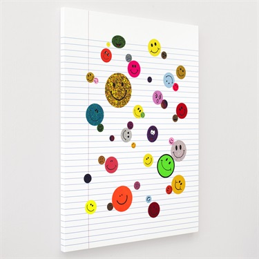 A piece of artwork with smiley faces.