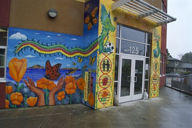 A colorful mural painted on the wall of a building. 