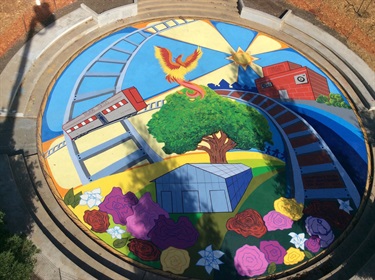 A colorful mural painted on the wall of a building. 