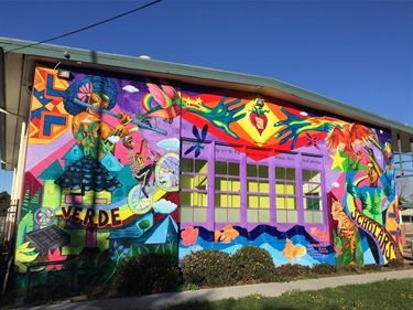 A colorful mural painted on the wall of a building. 