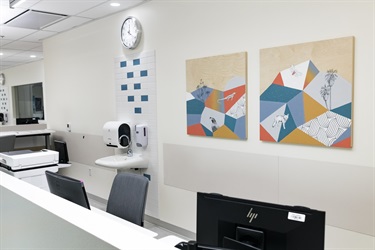 Artwork hanging on a wall in an office. 