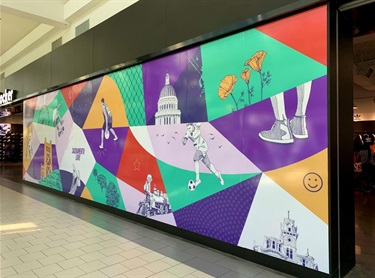 A piece of artwork installed in a walkway. 