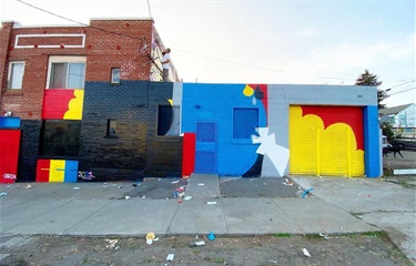 A mural painted on the side of a building. 