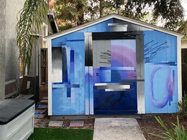 A mural painted on a shed structure. 