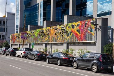 A colorful art installation on a building exterior.