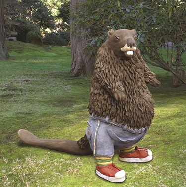 A sculpture of a beaver wearing pants and shoes. 