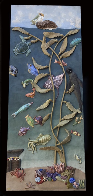 A sculpture of an underwater ocean sea on a wall. 