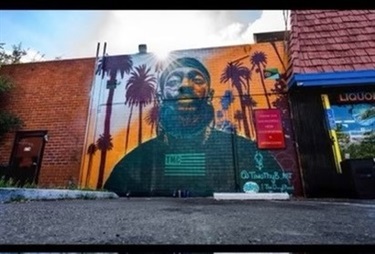 A colorful mural on the side of a building. 