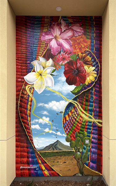 A painted mural on the side of a building. 