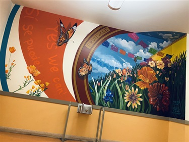 A painted mural on the side of a building. 