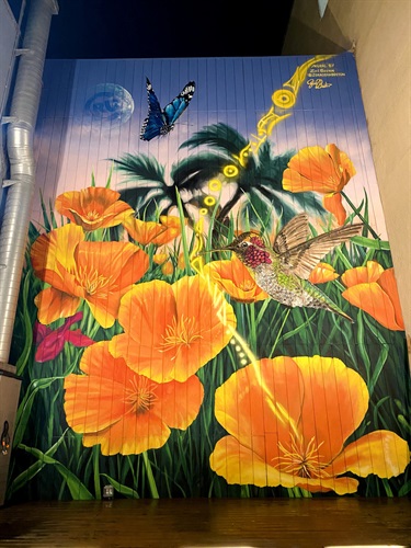 A painted mural on the side of a building. 