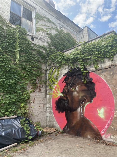 A painted mural on the side of a building. 