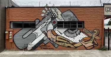 A mural on the side of a wall. 