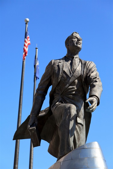 A bronze sculpture of a person.