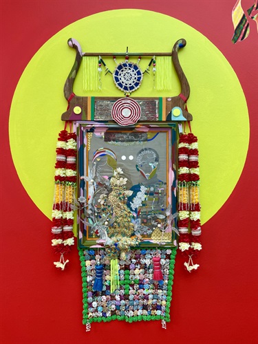 An art installation with a yellow and red background. 