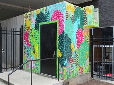 A colorful mural on a building. 