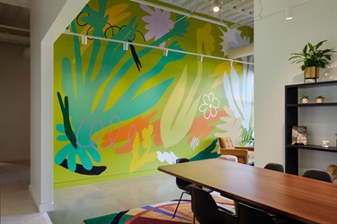 A colorful mural on the wall of a room. 