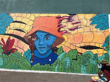 A brightly colored mural on a wall. 