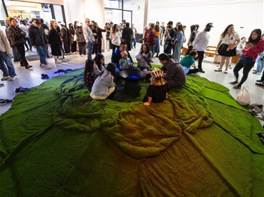 People interacting with a multimedia art installation.