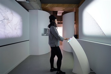 A person viewing an interactive art installation. 