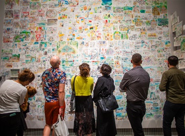 People looking at an art installation. 