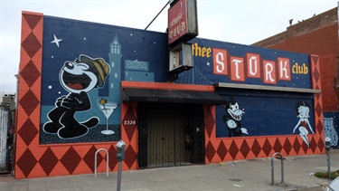 A mural painted on the side of a building. 