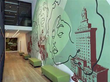 A mural on the wall along a corridor. 