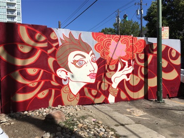 A mural painted on an outdoor wall.