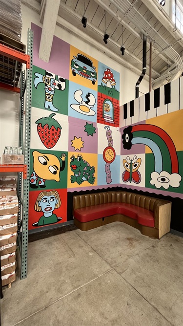 A painting above a bench. 