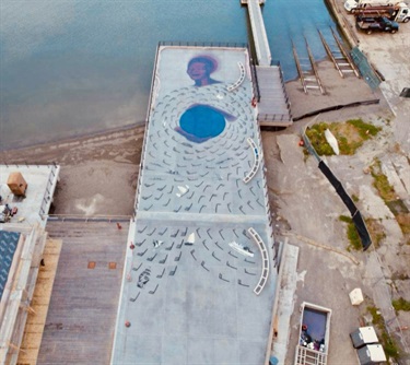 An aerial view of artwork on a pier. 