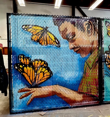 A mural painted on a fence. 