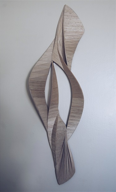 An abstract sculpture against a white background. 