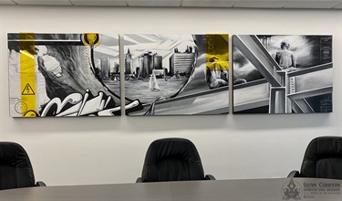 A series of painting on a wall. 