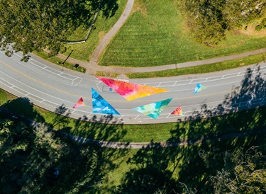 An aerial view of a painting on a street. 