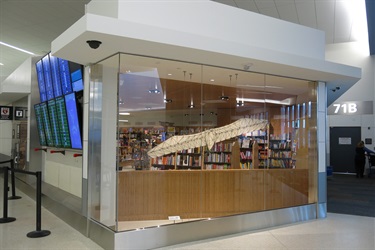 A sculpture in the window of a store.