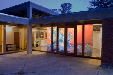 Artwork in the window of a building.