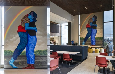 A mural of two people painted on a wall inside a room. 