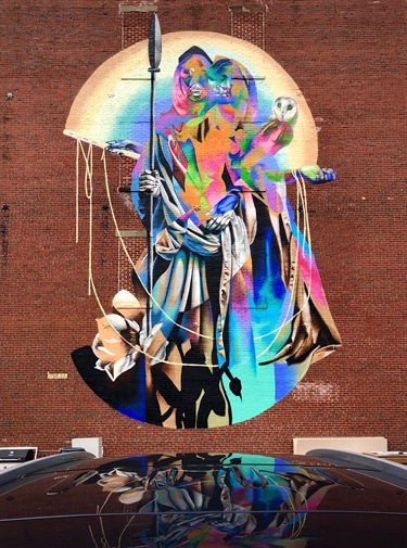 A mural on the side of a building. 