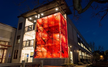A building with a red window design. 