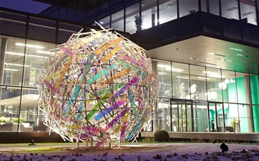 An abstract sculpture outside of a building.