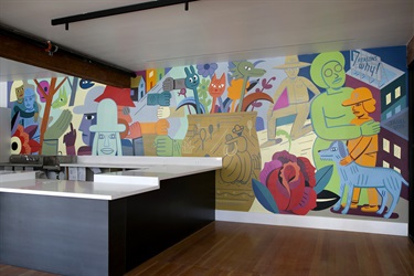 A mural on on a wall inside a room. 