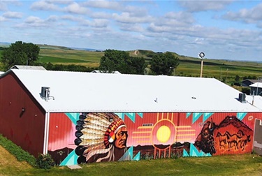 A mural painted on the side of a building. 