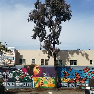 A mural painted on the side of a building. 