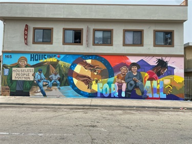 A mural painted on the side of a building. 