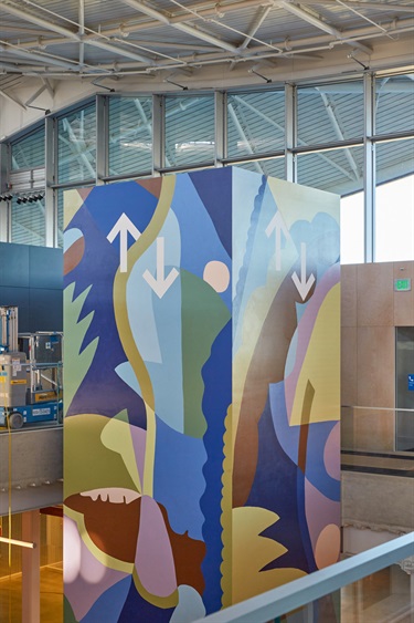 A mural painted on a column inside an office. 