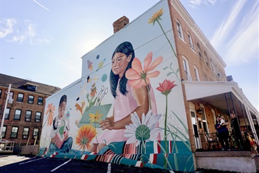 A mural painted on the side of a building. 