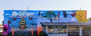 A mural painted on the side of a building. 