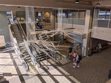 A sculpture suspended from the ceiling. 