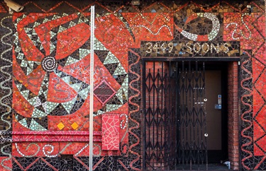 A tile mosaic on the facade of a building. 