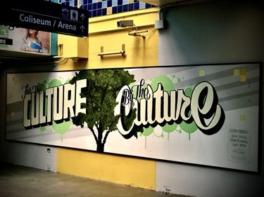 A mural with text on a wall. 